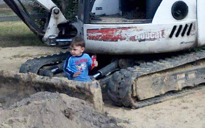 Boy in a Drain Field